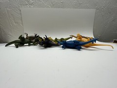 Lot of 8 Mixed Toy Plastic Rubber Dinosaurs. Tallest Around 4”.