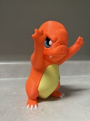 Charmander Pressed Against Window