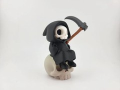 Kawaii Grim Reaper on Skull – Cute Spooky Desktop Decor