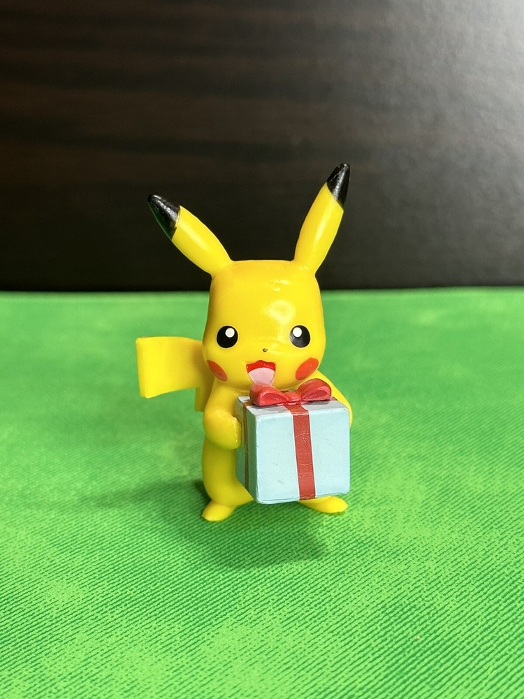 Pikachu Holding A Present Figure 2021 Jawares LLC
