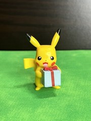 Pikachu Holding A Present Figure 2021 Jawares LLC