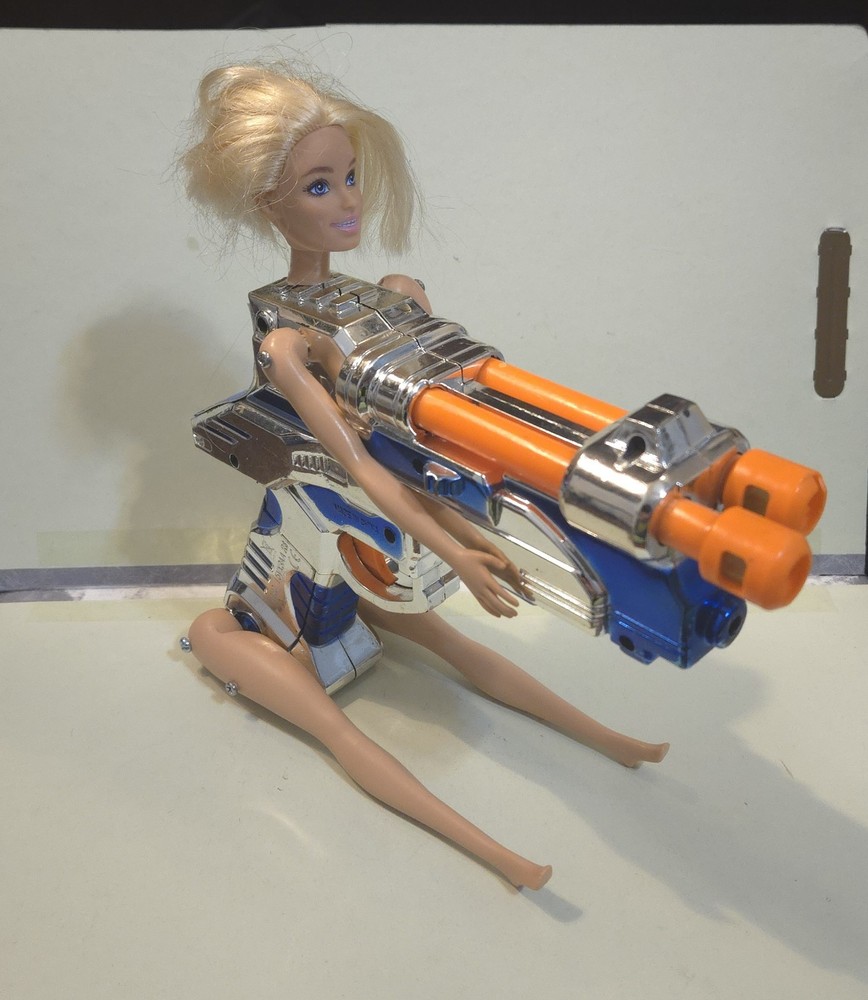 Doll on Blue and Silver Plastic Toy Space Gun. Sid Aardpiggy’s Halloween Story!