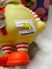 Ron English MC Supersized GLOW Red / Yellow 10″ vinyl figure, 2004 with box