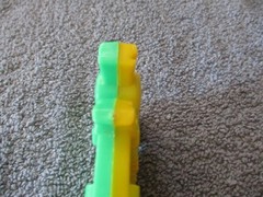 1975 Plastic Green/Yellow Toy Harmonica Have No Fear Underdog Is Here Lednardo