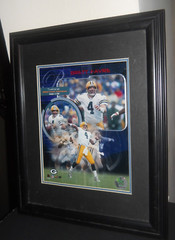 Bret Favre Mancave items 8″ x 10″ Photo in 13″ x 15″ Frame & Pro Action Football