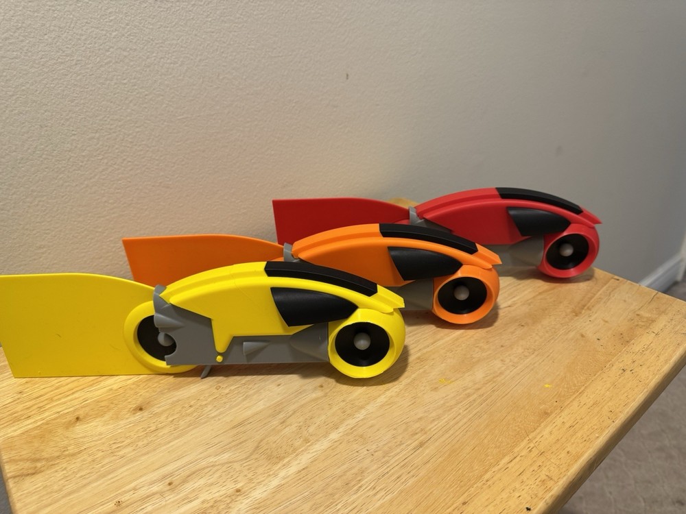 Tron Lightcycles With Light Trails. 3D Printed. Yellow. Orange. Red.