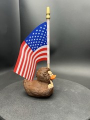 Bigfoot Ducky Figurine Guving The Middle Finger And Holding The American flag!