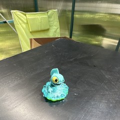 Blue Green Yellow Fish Figure Toy on Wave Translucent Base Plastic