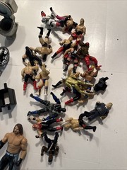Wrestling figures random accessories lot multiple companies WWF WCW etc.
