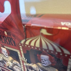 NECA Ultimate Bob Gray as Pennywise The Dancing Clown Welcome To Derry In Hand