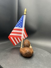 Bigfoot Ducky Figurine Guving The Middle Finger And Holding The American flag!