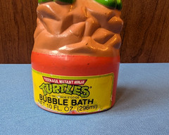 1989 empty 10oz bubble bath plastic bottle Teenage Mutant Ninja Turtles orange