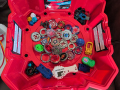 Mixed Beyblade Lot: Metal Fusion, Burst, 2 Stadium Arenas, Case, Launchers As Is
