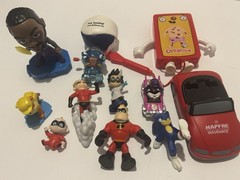 Collection of Various Small Toys and Action Figures Many of Which Seem Much More
