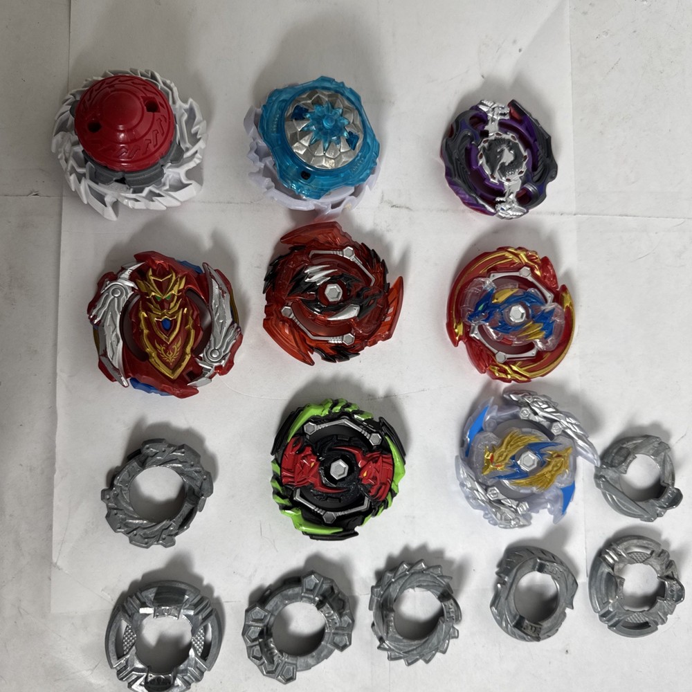 Bay Blades Lot Of 8 Bayblades Plus Parts and launchers
