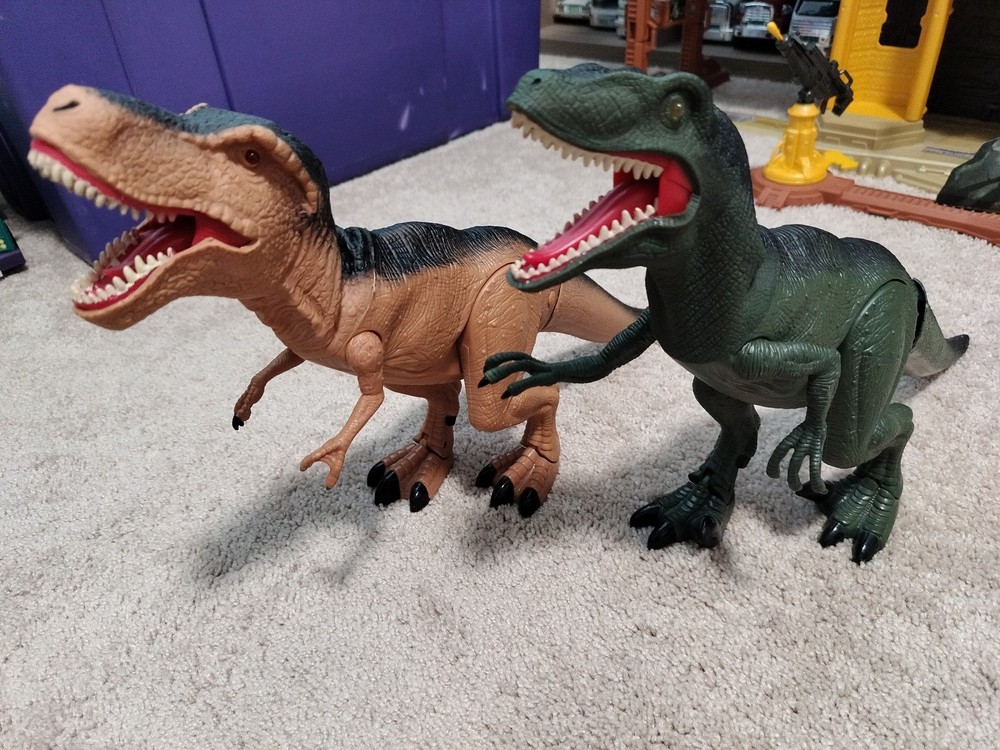 Mighty Megasaurs Electronic Walking T-Rex & Velociraptor – Roars Lights Up
