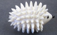 Adorable White Hard Plastic Hedgehog Toy – 3½” long x 2″ tall