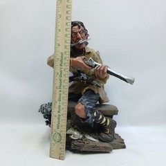 Resin Pirate 10″ Statue with Knife, Musket & Pistol on a bench with treasures