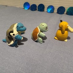 1999 POKÉMON FIGURES AND COINS SET WITH TWO-“RARE” PURPLE AND TRANSLUCENT FIGS