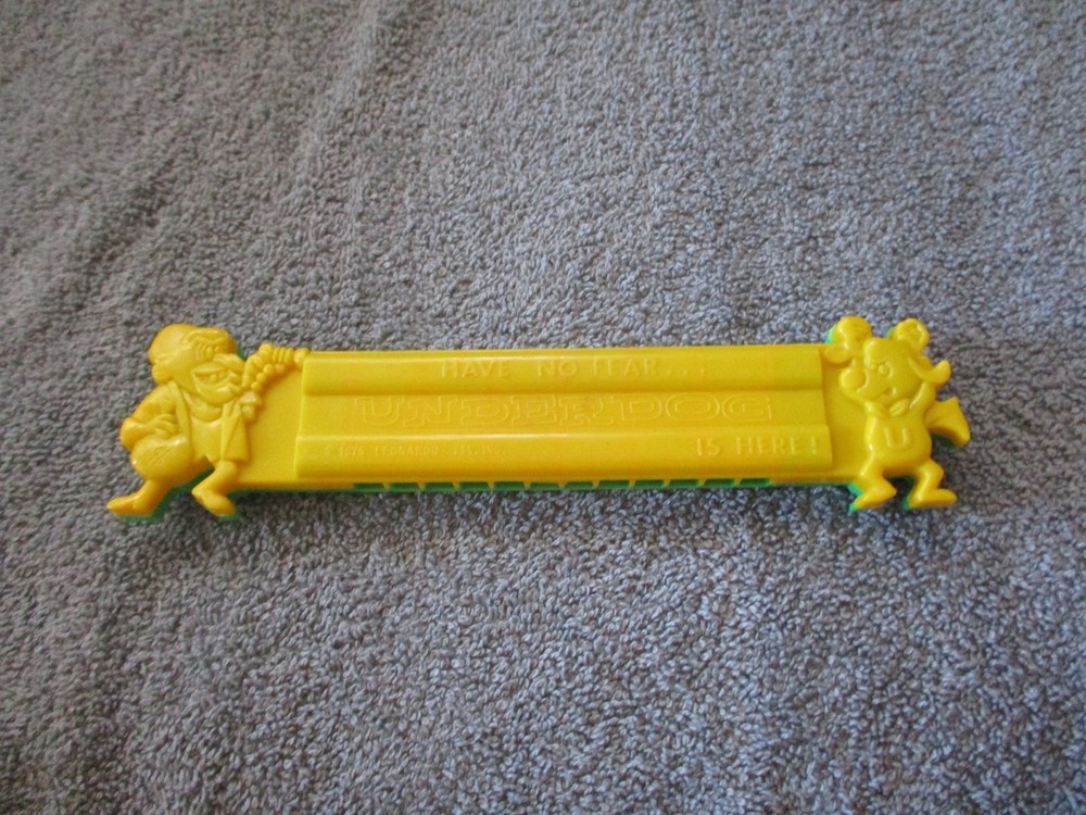 1975 Plastic Green/Yellow Toy Harmonica Have No Fear Underdog Is Here Lednardo