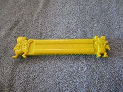 1975 Plastic Green/Yellow Toy Harmonica Have No Fear Underdog Is Here Lednardo