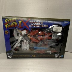 Takara Tomy Hasbro Transformers Street Fighter Optimus Prime vs Megatron Boxed …