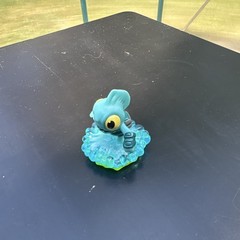 Blue Green Yellow Fish Figure Toy on Wave Translucent Base Plastic