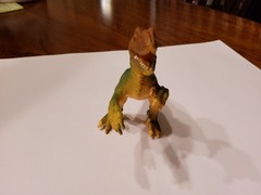 velociraptor action figure 5 1/2 inches. Made in china