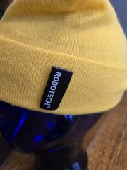 Robotech beanie max yellow one size excellent condition new without tags.