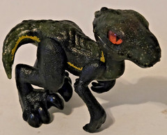 Jurassic World Indoraptor Mini Dinosaur Figure Black Gold Red Eyes Mystery Pack