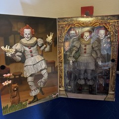 NECA Ultimate Bob Gray as Pennywise The Dancing Clown Welcome To Derry In Hand