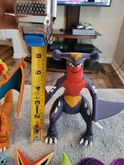 Pokémon Mixed Lot Of Figures, Coins, Pins, Tops Trading Cards