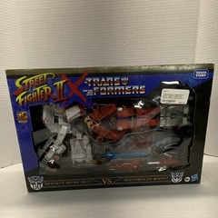 Takara Tomy Hasbro Transformers Street Fighter Optimus Prime vs Megatron Boxed …