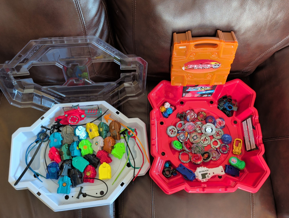 Mixed Beyblade Lot: Metal Fusion, Burst, 2 Stadium Arenas, Case, Launchers As Is