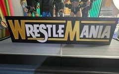 WWE Mattel Large 12 X 3 White/Gold WrestleMania Logo Accessory