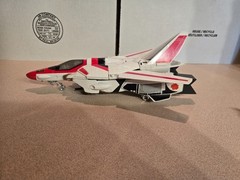 Vintage 1985 Transformers G1 Jetfire figure with accessory pieces.