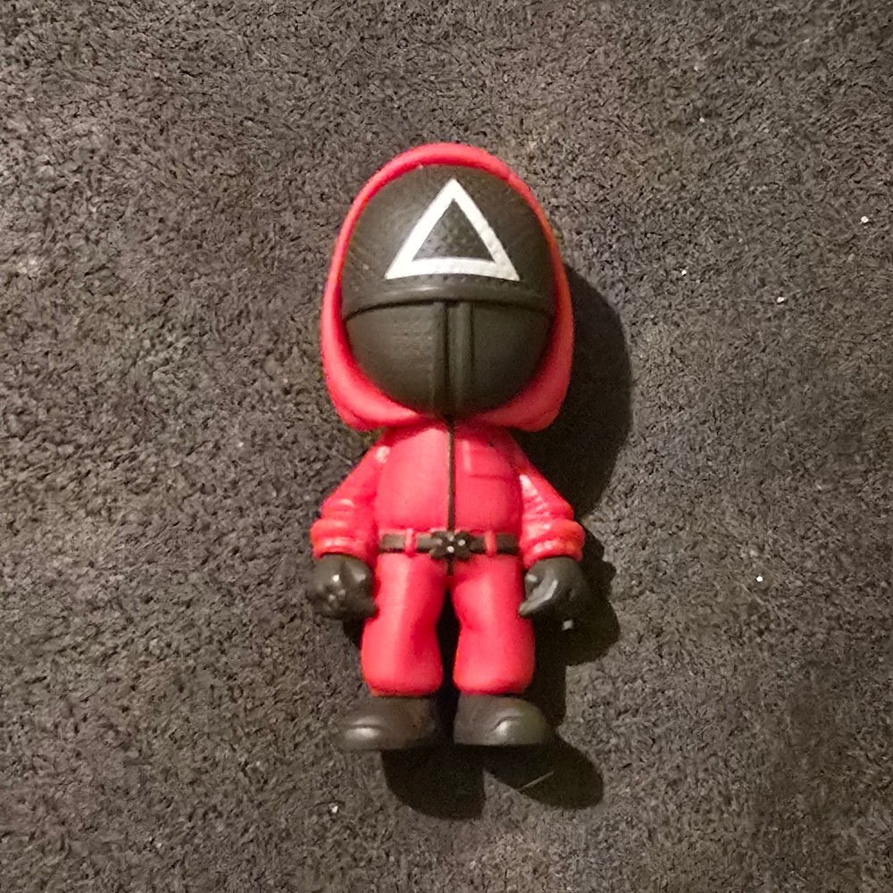 YuMe Piggy Bank Squid Games Mystery Capsule Triangle Solder Mini Figure 2.5″