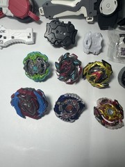 Beyblade Lot – Beyblades, Parts, and Launchers – See Photos & Read Desc