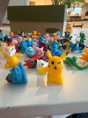 About 100 tiny pokemon figurines