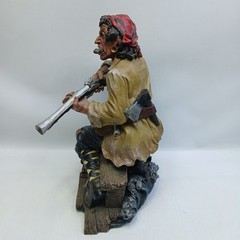 Resin Pirate 10″ Statue with Knife, Musket & Pistol on a bench with treasures