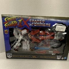 Takara Tomy Hasbro Transformers Street Fighter Optimus Prime vs Megatron Boxed …