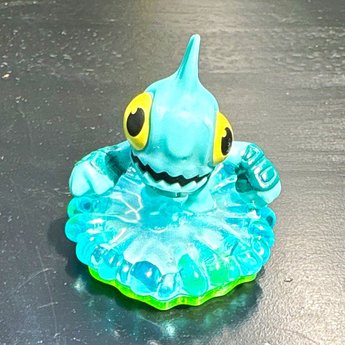 Blue Green Yellow Fish Figure Toy on Wave Translucent Base Plastic