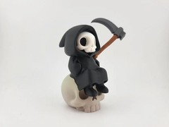 Kawaii Grim Reaper on Skull – Cute Spooky Desktop Decor