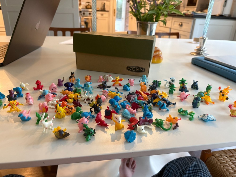 About 100 tiny pokemon figurines