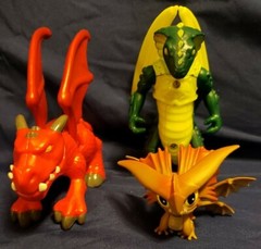 3 Cartoonish looking Dragons, large eyes, different brands