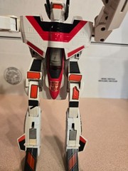 Vintage 1985 Transformers G1 Jetfire figure with accessory pieces.