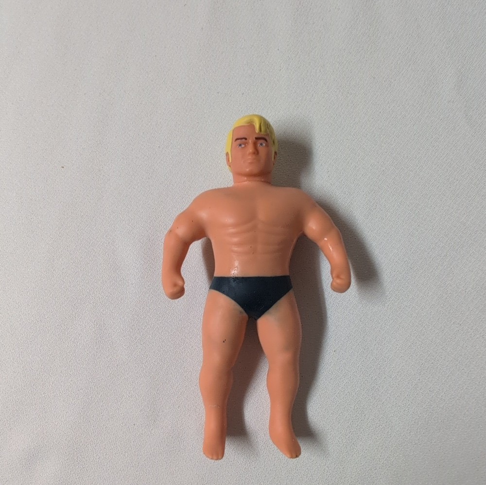 Stretch Armstrong Action Figure Blonde Male Rubber Black Shorts Beige Yellow