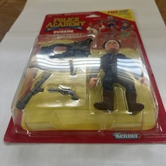 Kenner Police Academy Eugene Tackleberry Boxed Figure w/ Flak Vest & Weapons