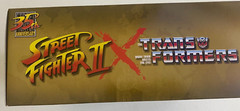 Transformers Collaborative Street Fighter II Mash-Up Hot Rod Ken vs. Arcee Ch…