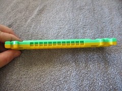 1975 Plastic Green/Yellow Toy Harmonica Have No Fear Underdog Is Here Lednardo
